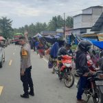 Bhabinkamtibmas Polsek Bambalamotu Pengamanan dan Pengaturan di Pasar Tradisional