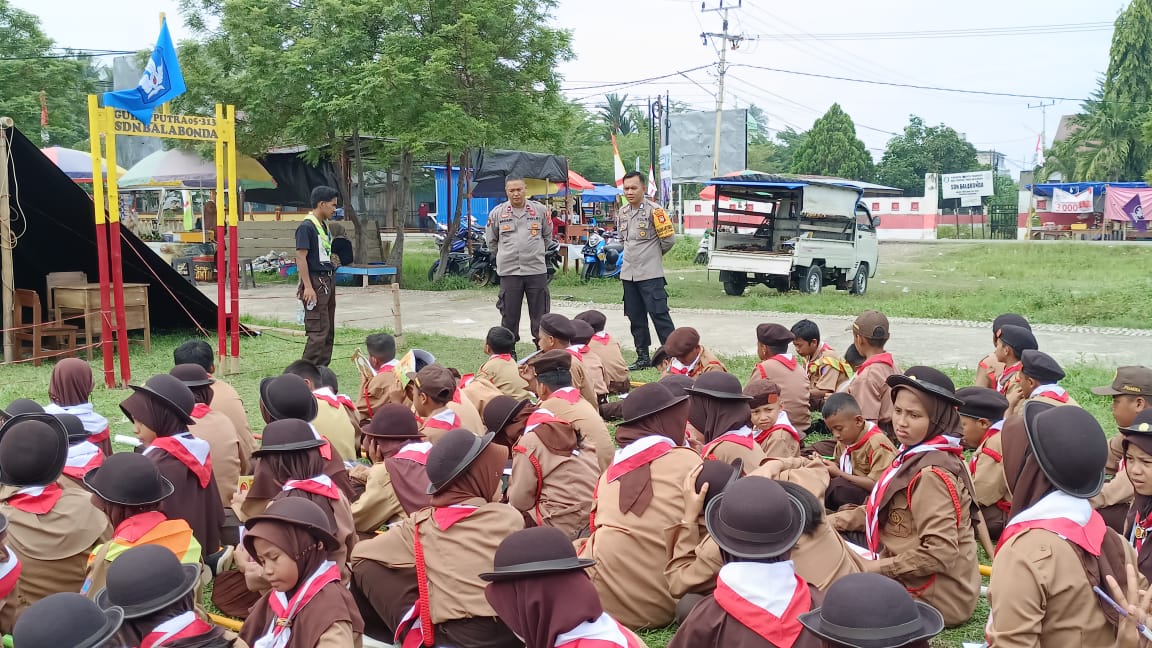 Kapolsubsektor Sarjo Bersama Bhabinkamtibmas Polsek Bambalamotu Pantau Kegiatan Latgab Pramuka