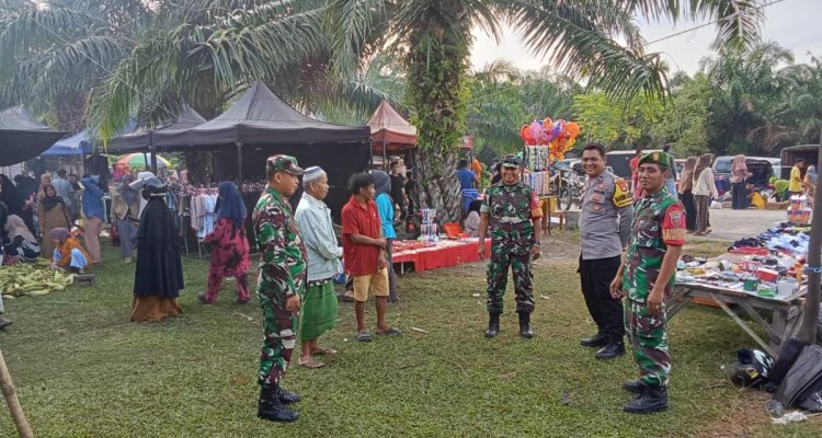 Bhabinkamtibmas Polsek Bambalamotu Pengamanan Pemindahan Pasar Tradisional 