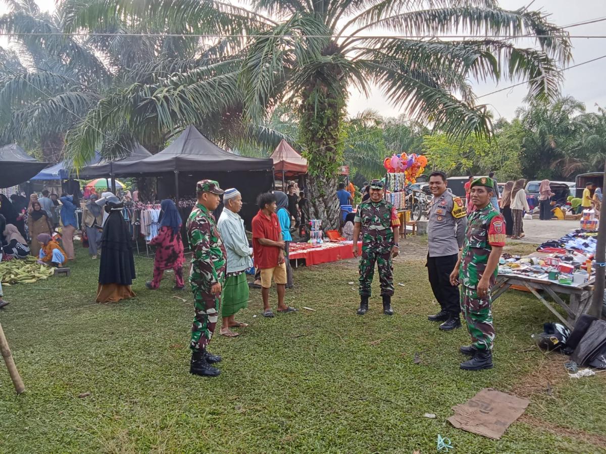 Bhabinkamtibmas Polsek Bambalamotu Pengamanan Pemindahan Pasar Tradisional 